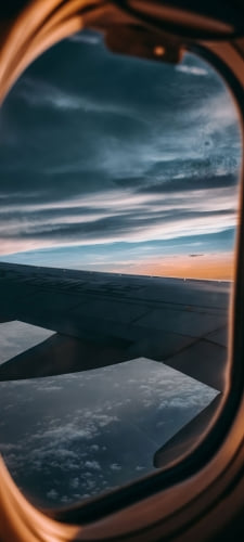 機窓から見える主翼 / 飛行機のAndroid用のスマホ壁紙