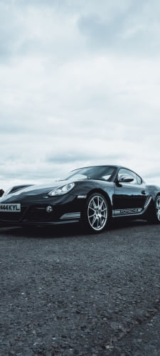 黒のポルシェ カイマンのAndroid用のスマホ壁紙
