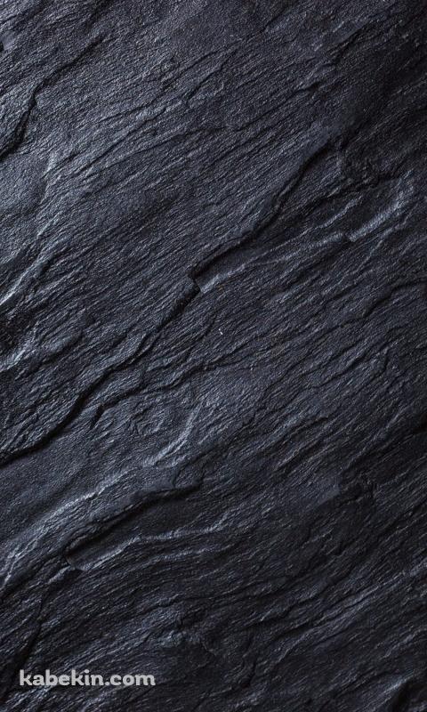 硬質な黒い岩肌のAndroidの壁紙(480px x 800px) スマホ用