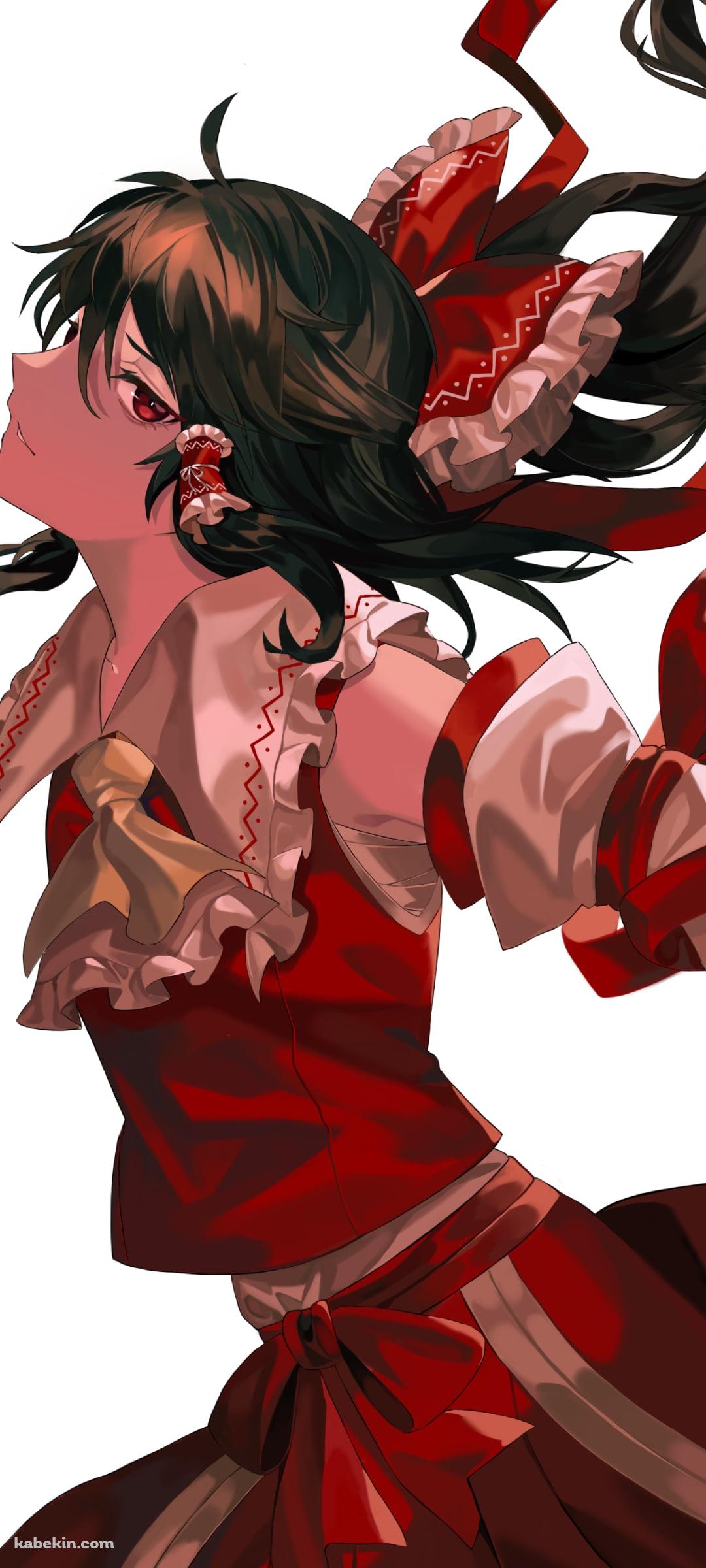 髪をなびかせ赤い瞳でこちらを見つめるかっこいい博麗霊夢 / 東方のAndroidの壁紙(1080px x 2400px) スマホ用