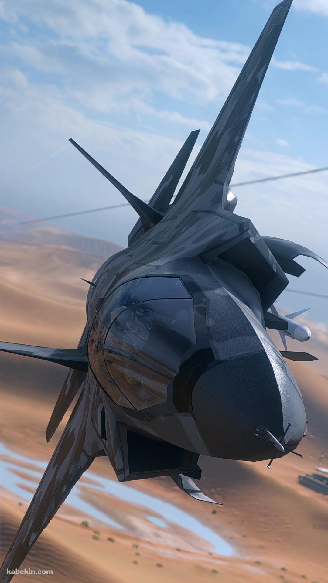 砂漠の上を飛行する黒い戦闘機のAndroidの壁紙(1080px x 1920px) スマホ用