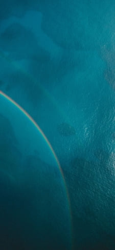 上から見た海と虹のiPhone / スマホ壁紙