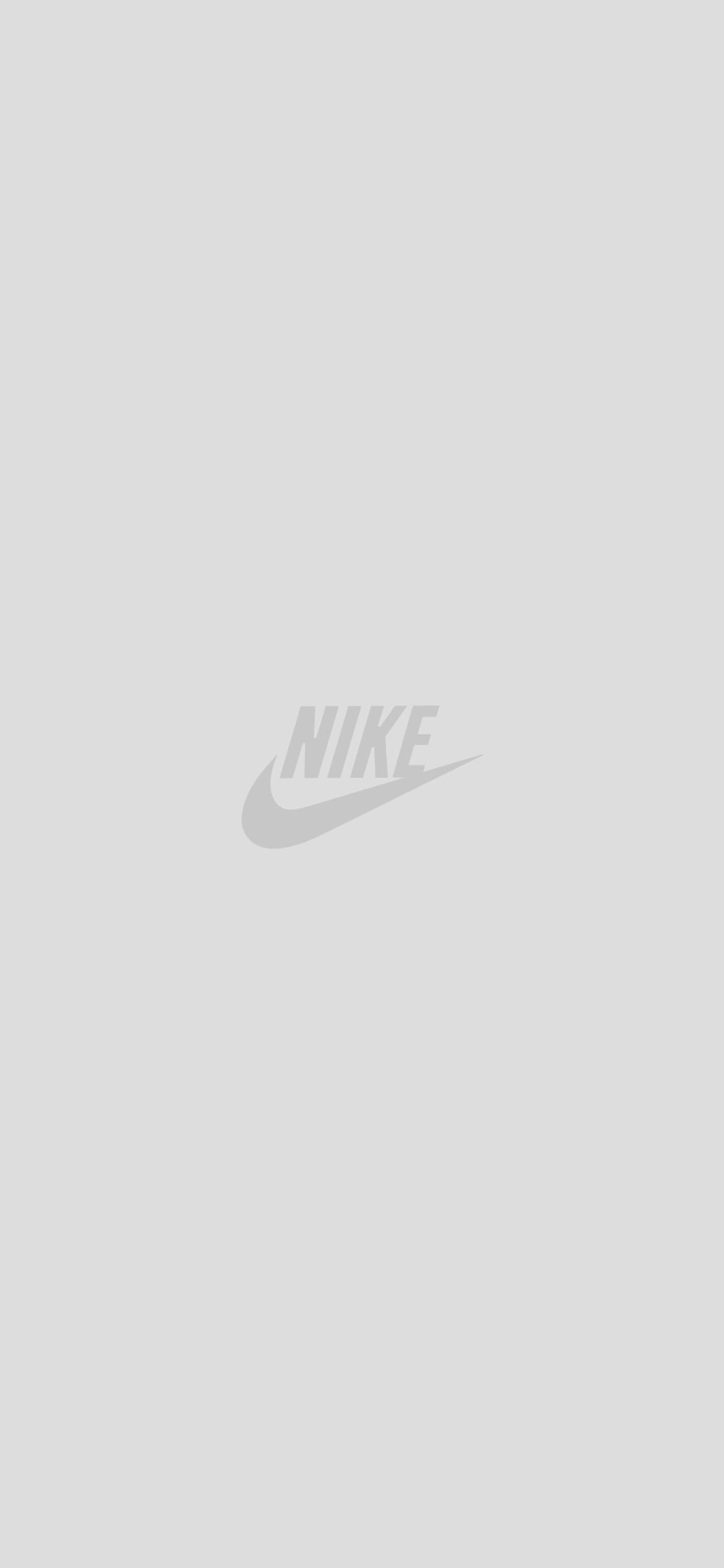 灰色のNIKEのロゴの1170 x 2532 / スマホ壁紙
