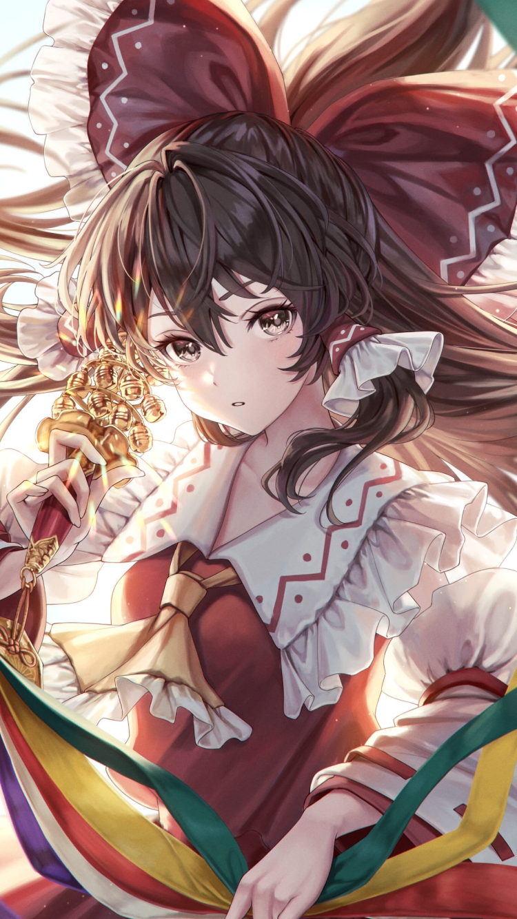 カラフルな魔除けの道具を持つ博麗霊夢 / 東方の750 x 1334 / スマホ壁紙