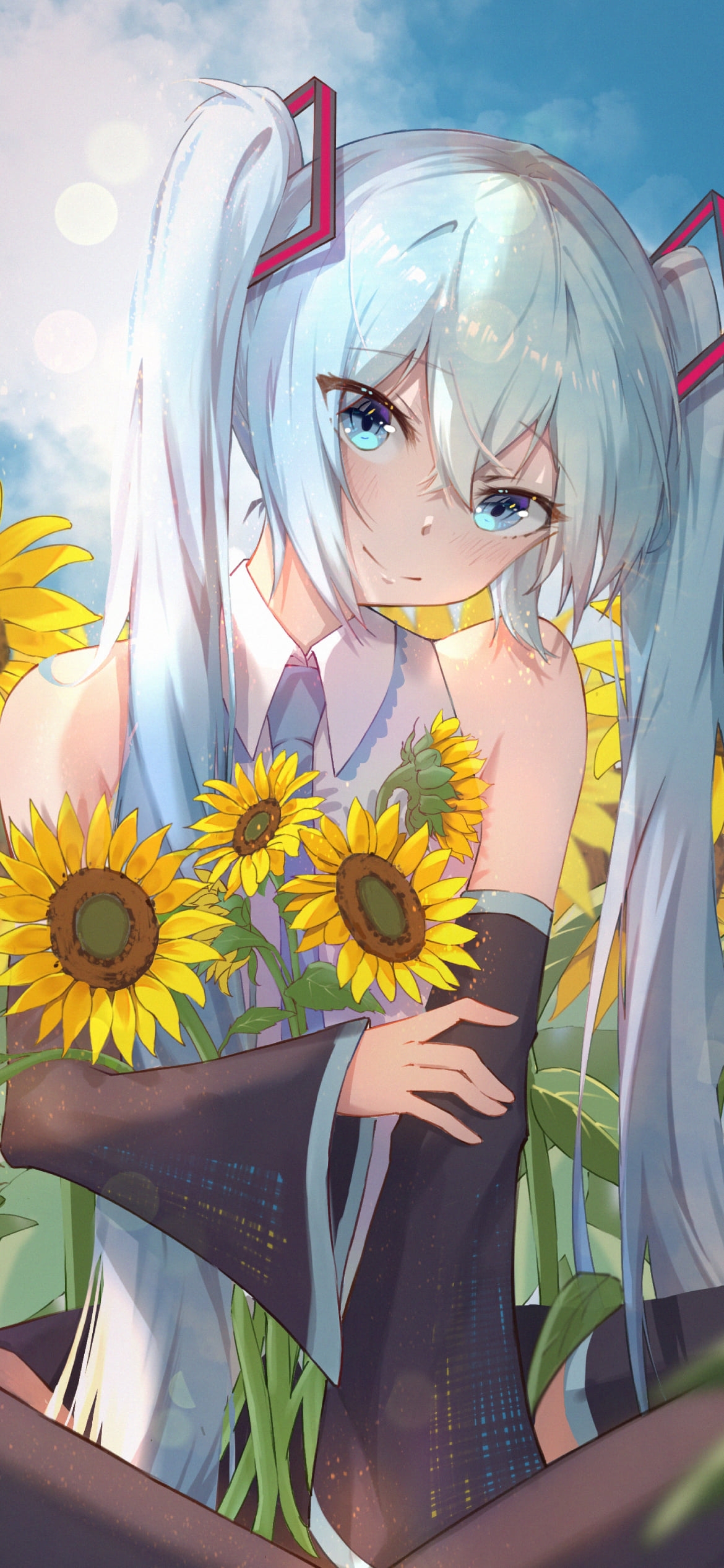 青空の下、向日葵を抱える初音ミク / ボカロ / ボーカロイドの1170 x 2532 / スマホ壁紙