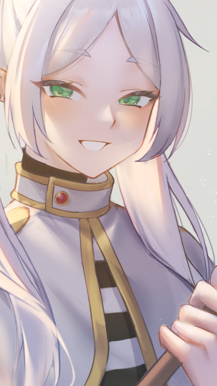 杖を持ち笑うフリーレン / 葬送のフリーレンの750 x 1334 / スマホ壁紙