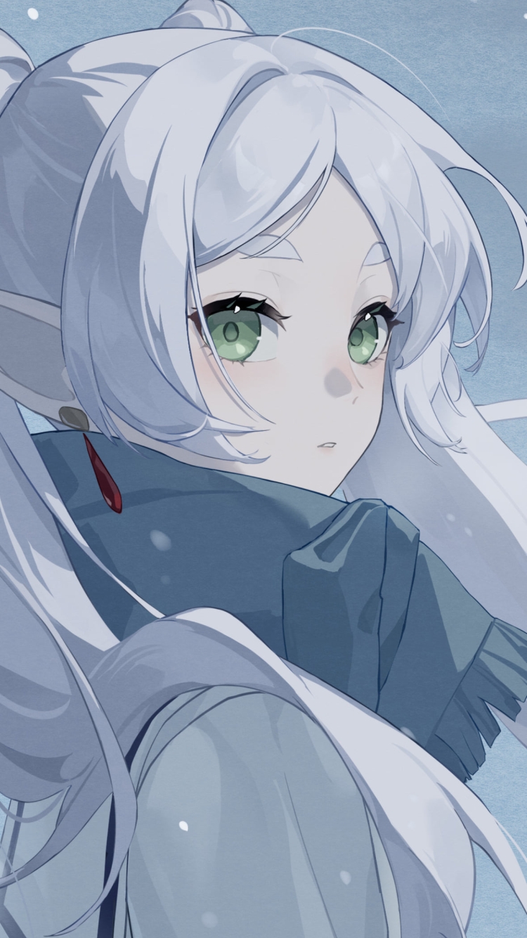 雪が降る中、こちらを見つめるフリーレン / 緑の瞳 / 葬送のフリーレンの750 x 1334 / スマホ壁紙
