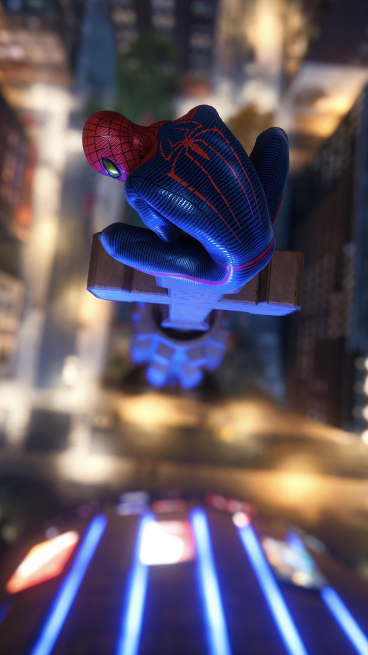 都会の高所に座るかっこいいスパイダーマンの750 x 1334 / スマホ壁紙