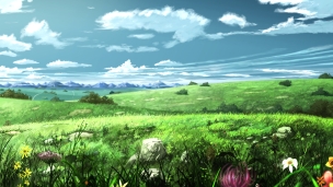カラフルな花が咲く綺麗な草原と遠くに見える山脈のデスクトップPC用の壁紙