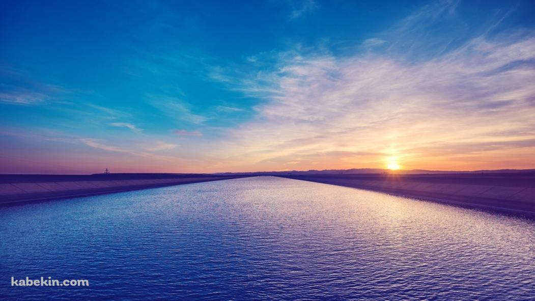 青い海 防波堤 夕日の壁紙(1051px x 591px) 高画質 PC・デスクトップ用