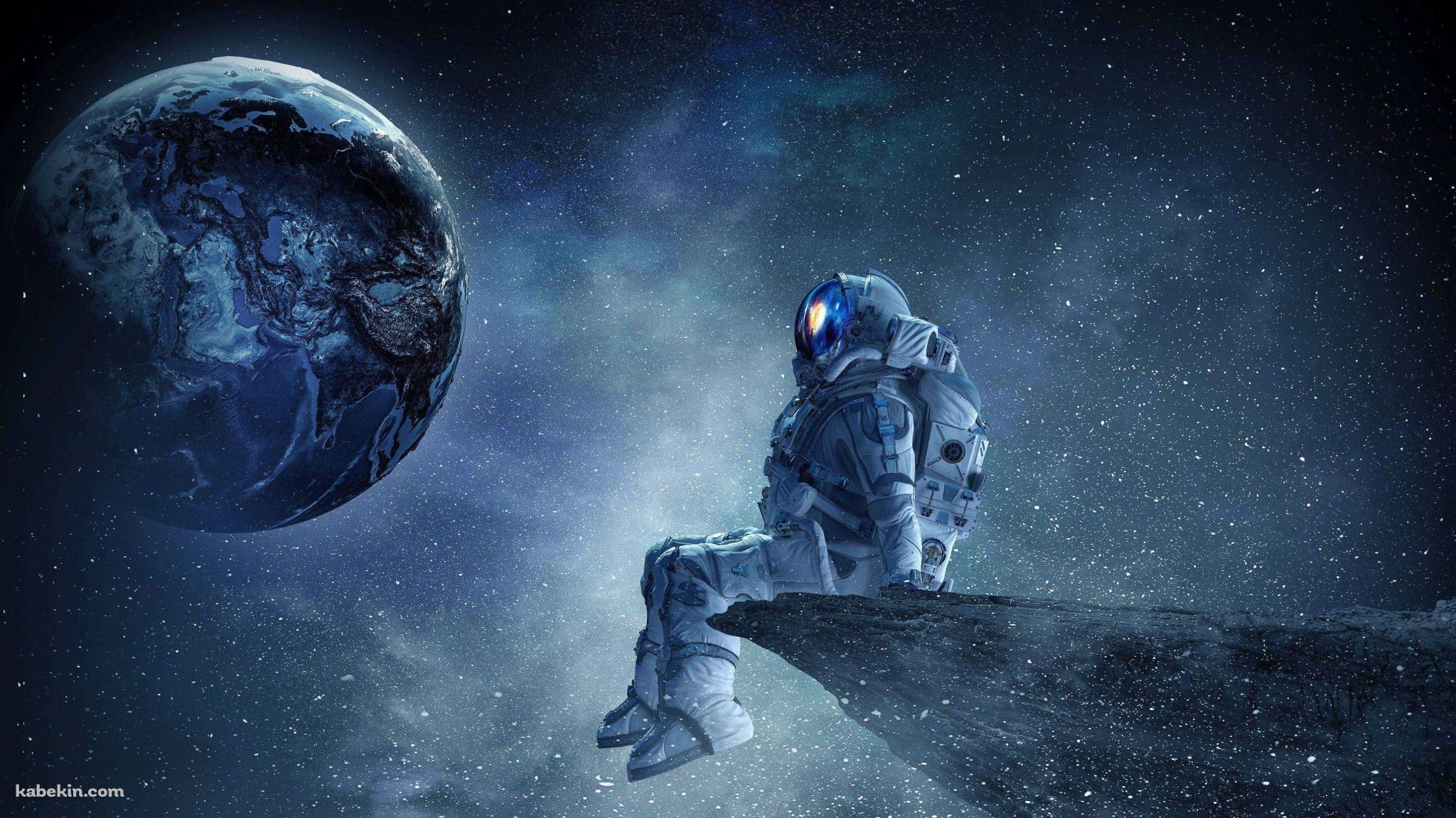 地球を眺める宇宙飛行士の壁紙(2048px x 1152px) 高画質 PC・デスクトップ用