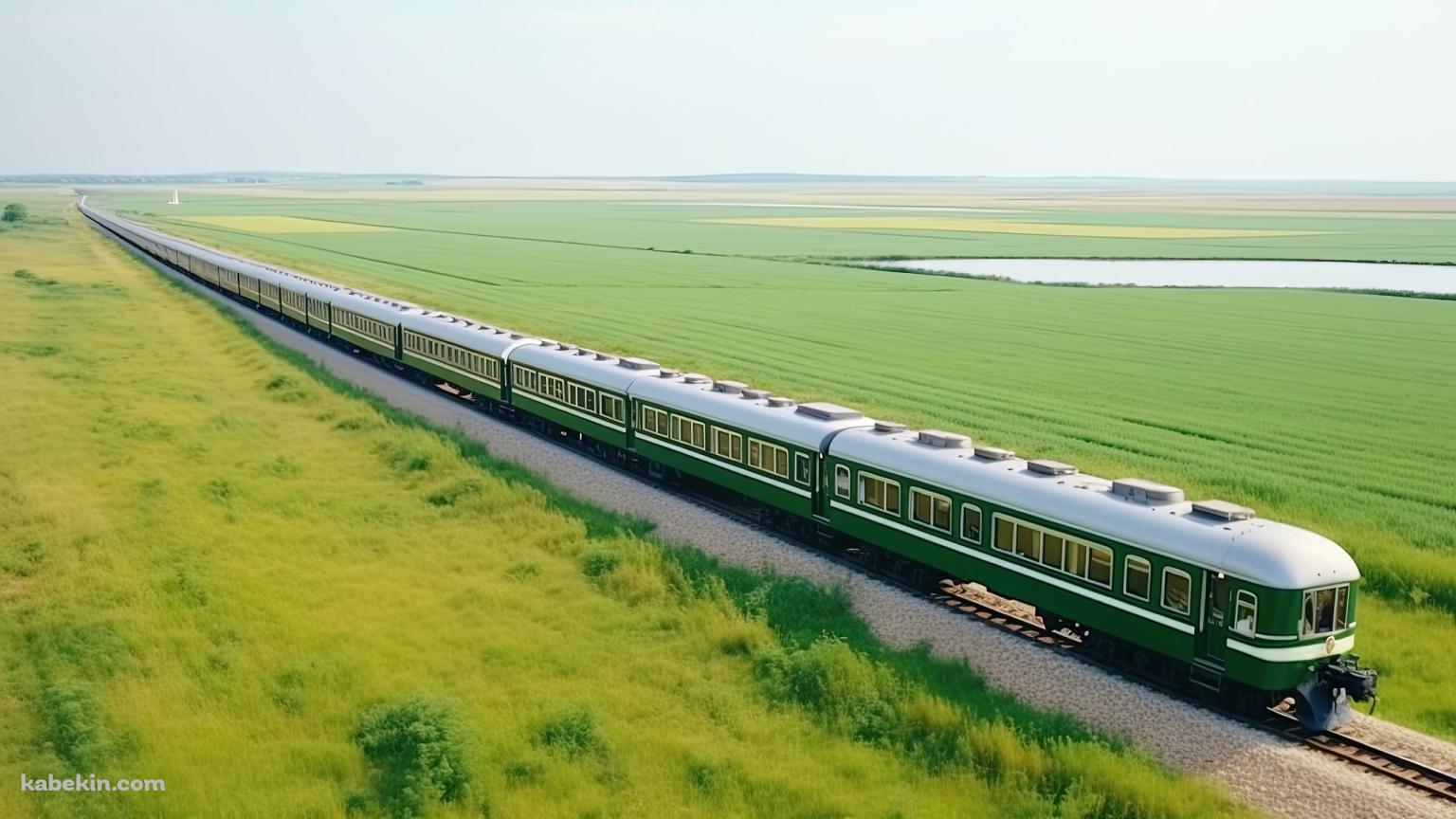 緑の草原の中を走る緑と白の電車の壁紙(1536px x 864px) 高画質 PC・デスクトップ用