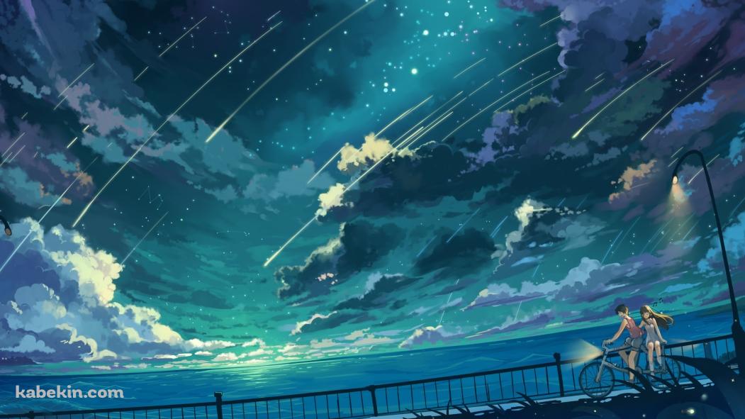 海沿いの道を自転車で二人乗りをするカップル / 流れ星の壁紙(1051px x 591px) 高画質 PC・デスクトップ用