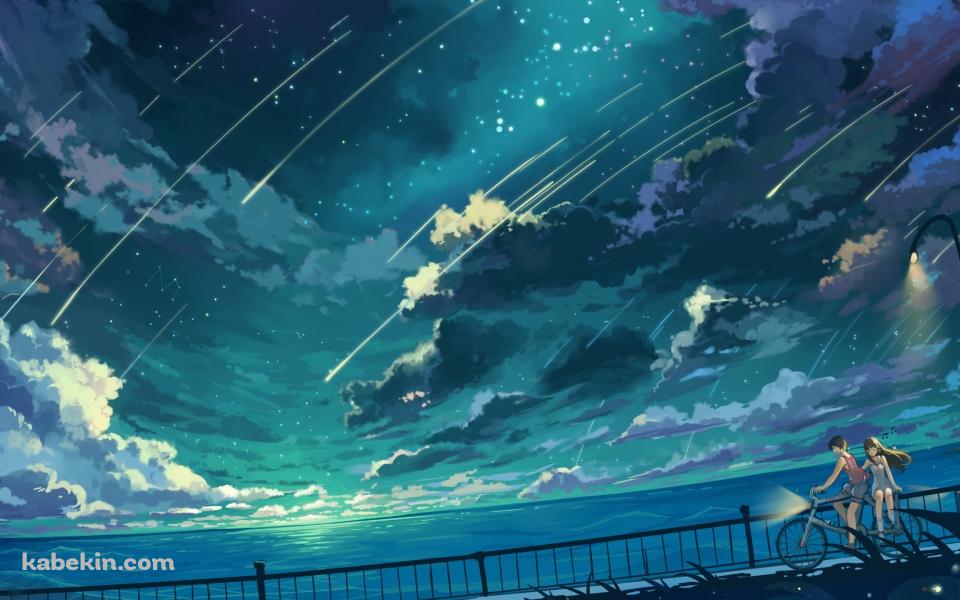 海沿いの道を自転車で二人乗りをするカップル / 流れ星の壁紙(960px x 600px) 高画質 PC・デスクトップ用