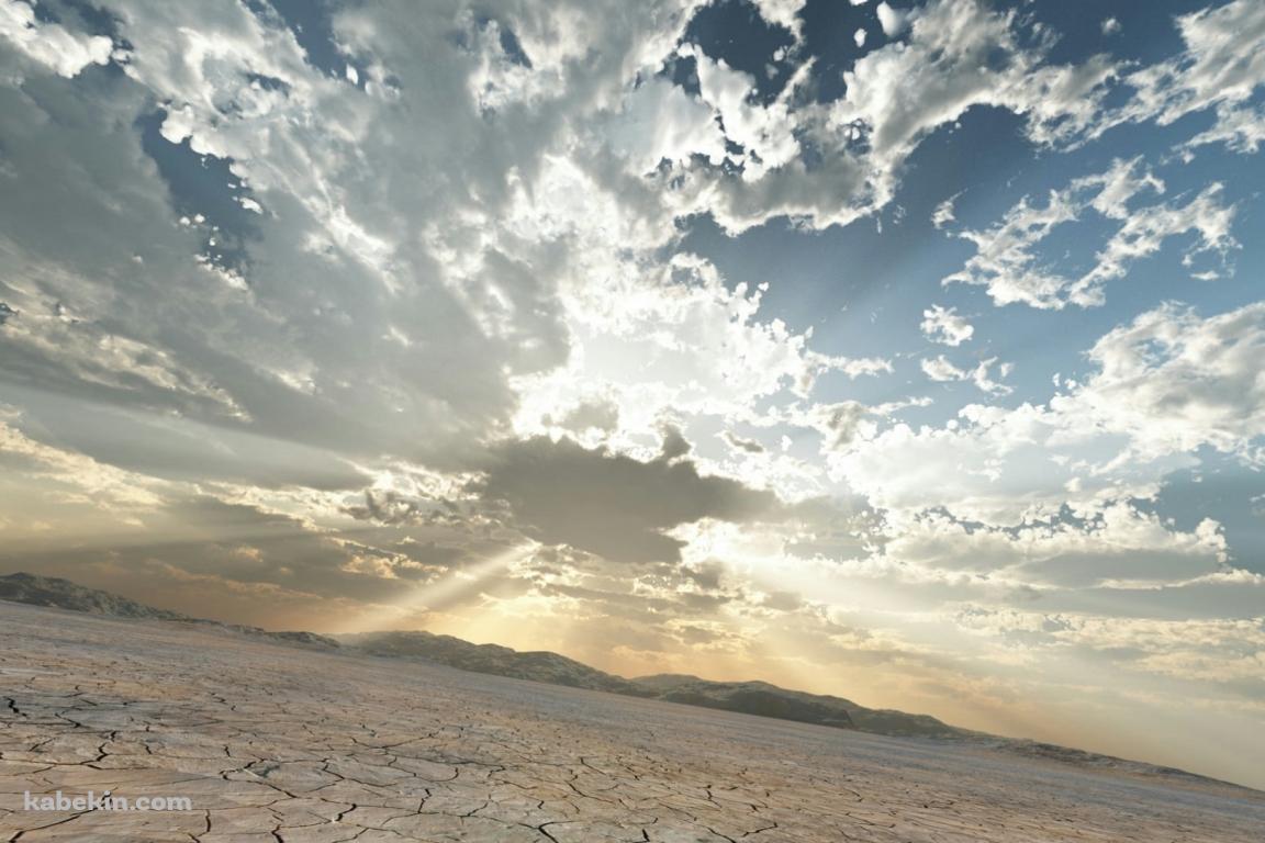 雲間から光りが射す乾いた大地の壁紙(1152px x 768px) 高画質 PC・デスクトップ用